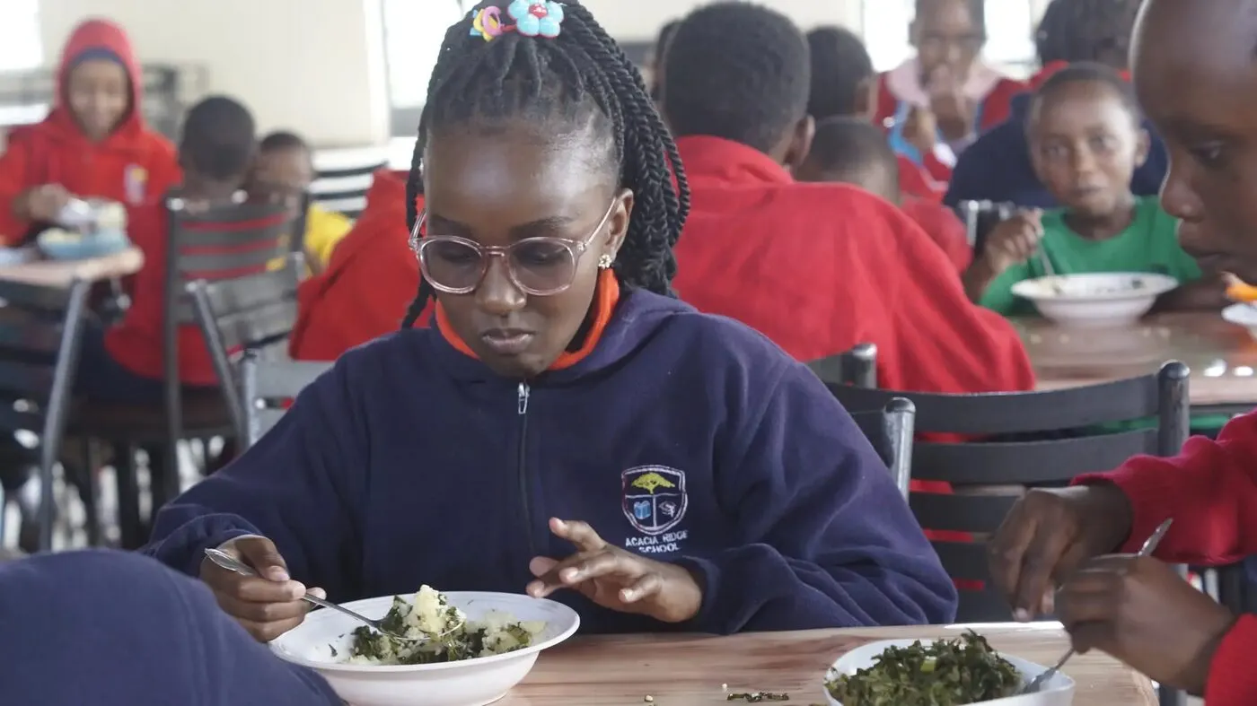 Boarders having a meal together in the dining hall