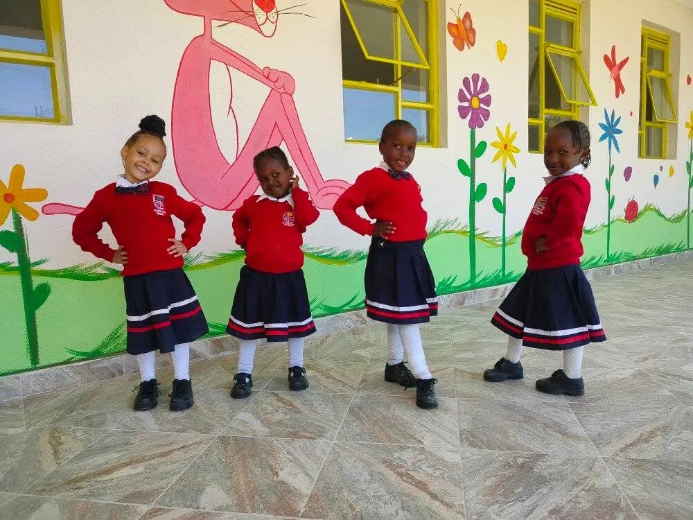 Kindergarten pupils in a bright, decorated classroom